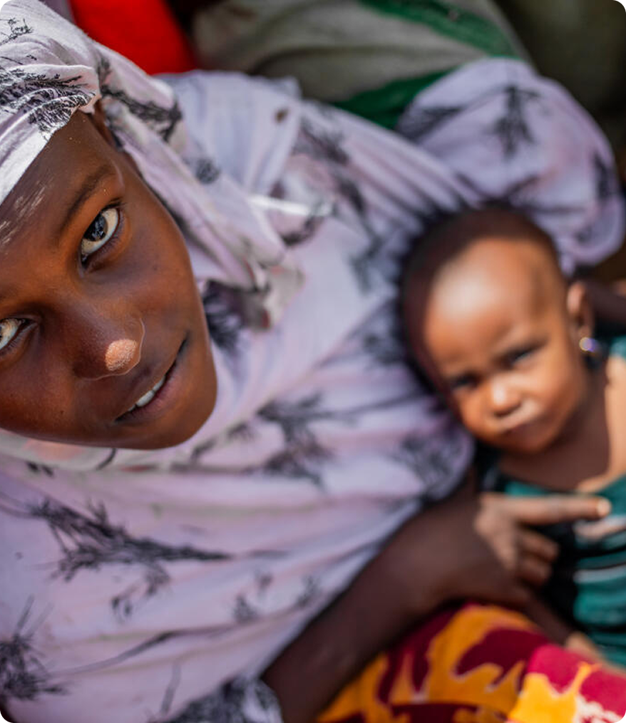 A person with a child representing community work